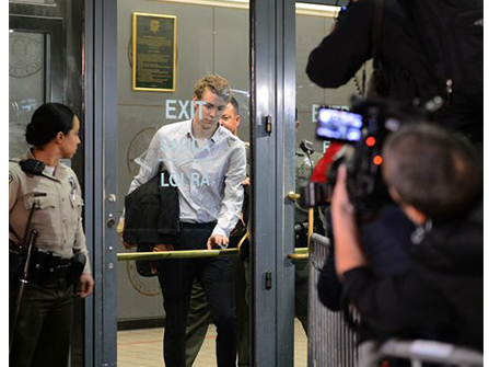 Tesla CEO Elon Musk reacts as newly sworn-in President Donald Trump speaks during the 60th inaugural ceremony