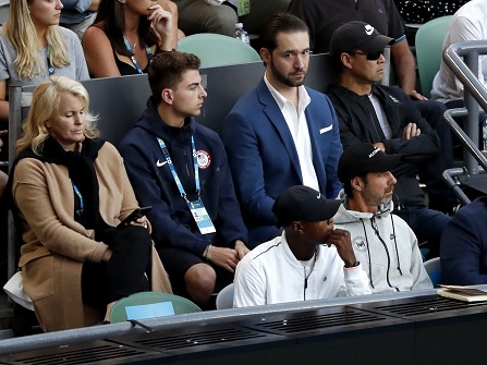 Supporters of United States' Serena Williams watch her match against sister Venus from the players box at the women's singles final at the Australian Open tennis championships in Melbourne, Australia, Saturday, Jan. 28, 2017. (AP Photo/Dita Alangkara)