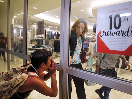 Protester screaming at shopper in a mall