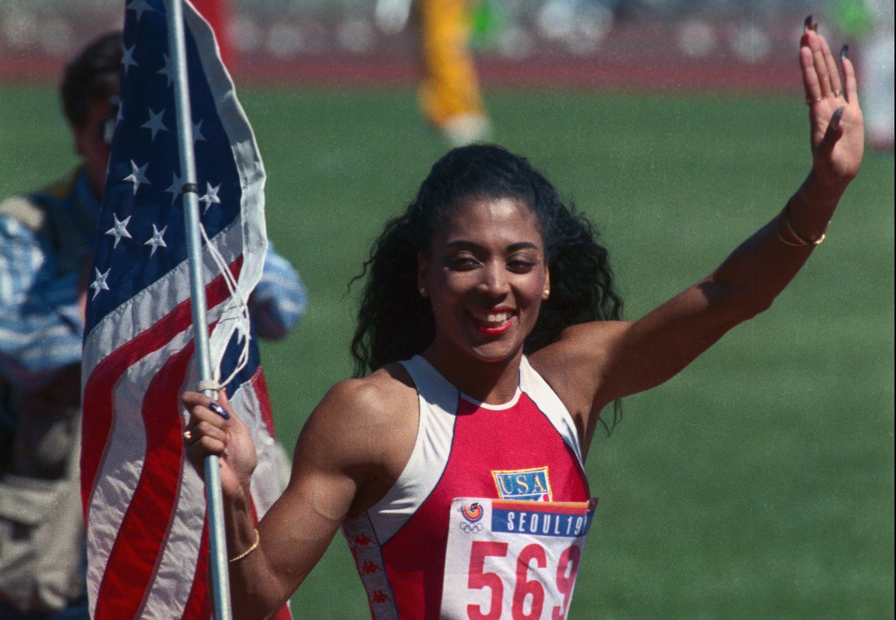 Folrence Joyner-Griffiths Carrying American Flag