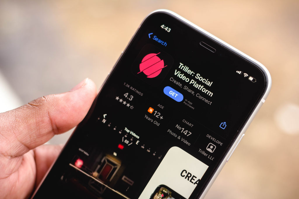 In this photo illustration the Triller logo in App Store...