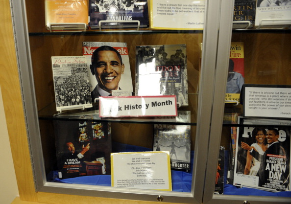 OBAMAHIGH12-- Photos of Barack Obama are in a display case for Black History Month in the hallway of Boulder High School. Boulder High School will keep its name after Student Worker, a student based activist organization at Boulder High School, stopped it
