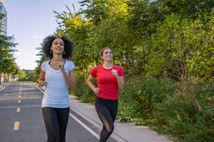 Friends exercising together outdoors in the city