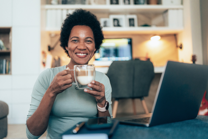 Woman with laptop at home