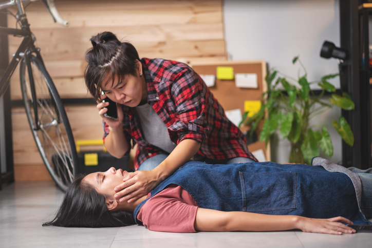 Emergency call to help on unconscious woman, Preparing first aids emergency CPR on heart attack woman in home, One part of the process resuscitation - healthcare and insurance concept.