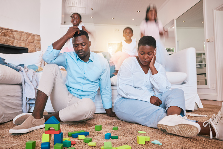 Home, family and parents with stress, frustrated and playing in living room, busy and burnout. Mother, father and female child with toys, adhd and fast speed in lounge, noise and hyper active kid
