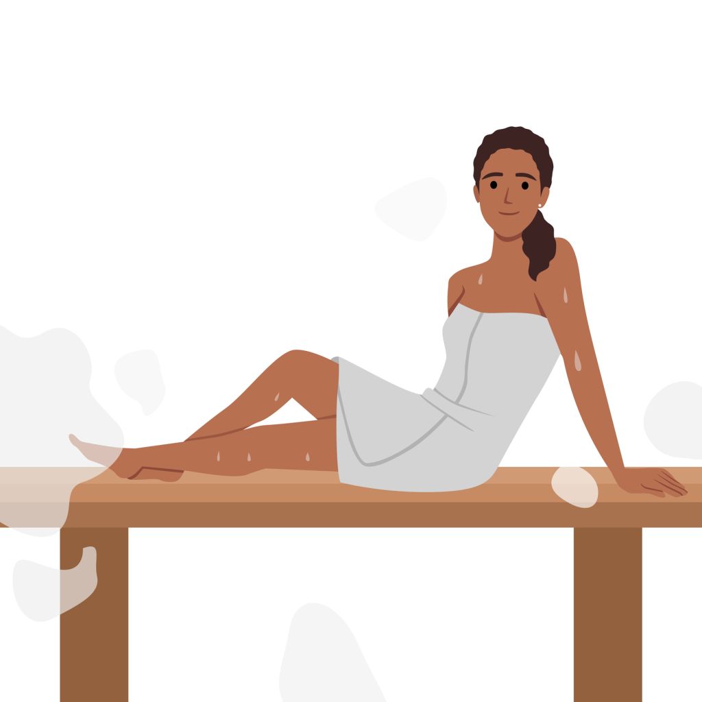 Woman in felt hat wrapped in body towel sits, sweating on bench in sauna.