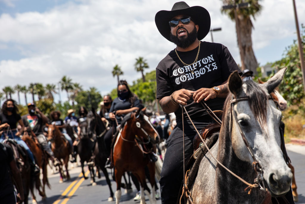 The Compton Cowboys participate in a Compton Peace Walk