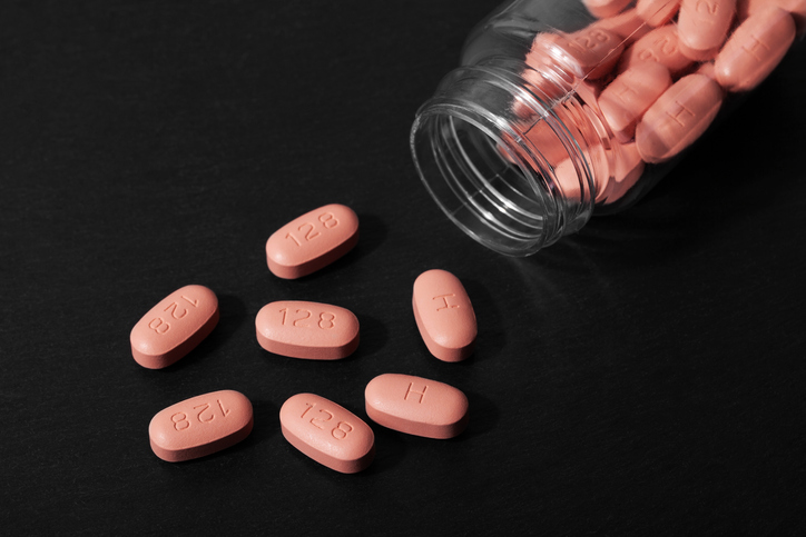 HIV/AIDS therapy pills on black background