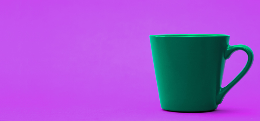 Green mug on purple neon background